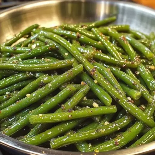 Plate of buttery green beans, a delicious side dish