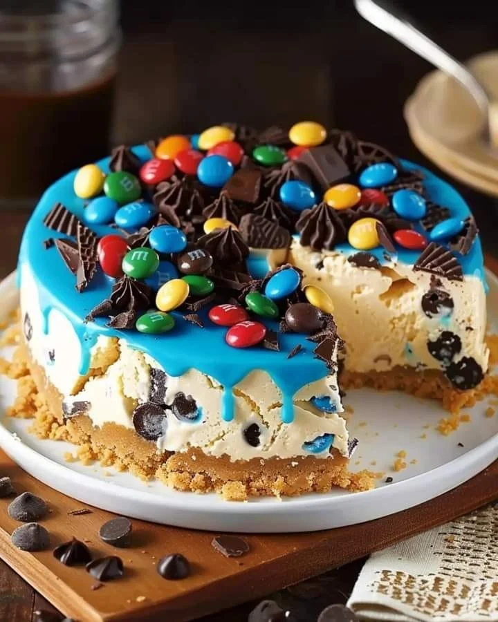 Monster Cookie Peanut Butter Pie topped with colorful cookie pieces and peanut butter swirl