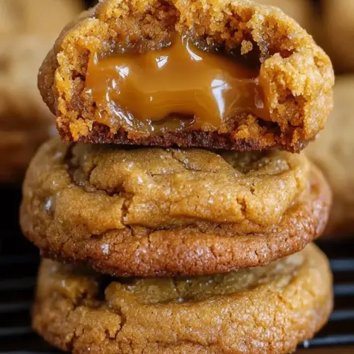 Freshly baked super creamy caramel cookies on a cooling rack