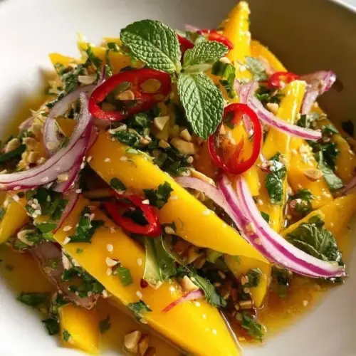 A colorful Thai Mango Cilantro Salad with fresh mango, cilantro, and veggies