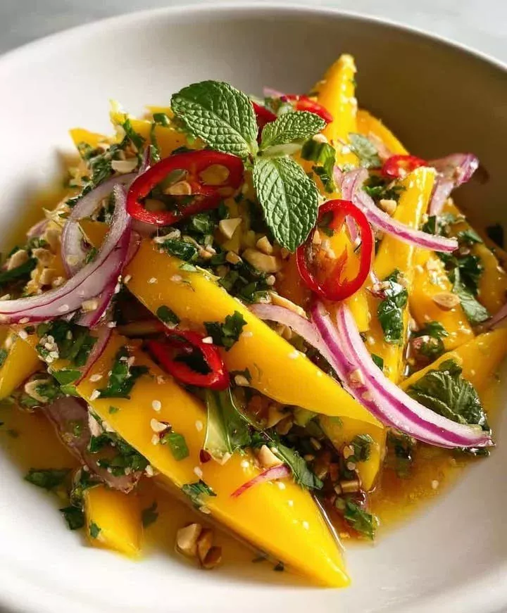 A colorful Thai Mango Cilantro Salad with fresh mango, cilantro, and veggies